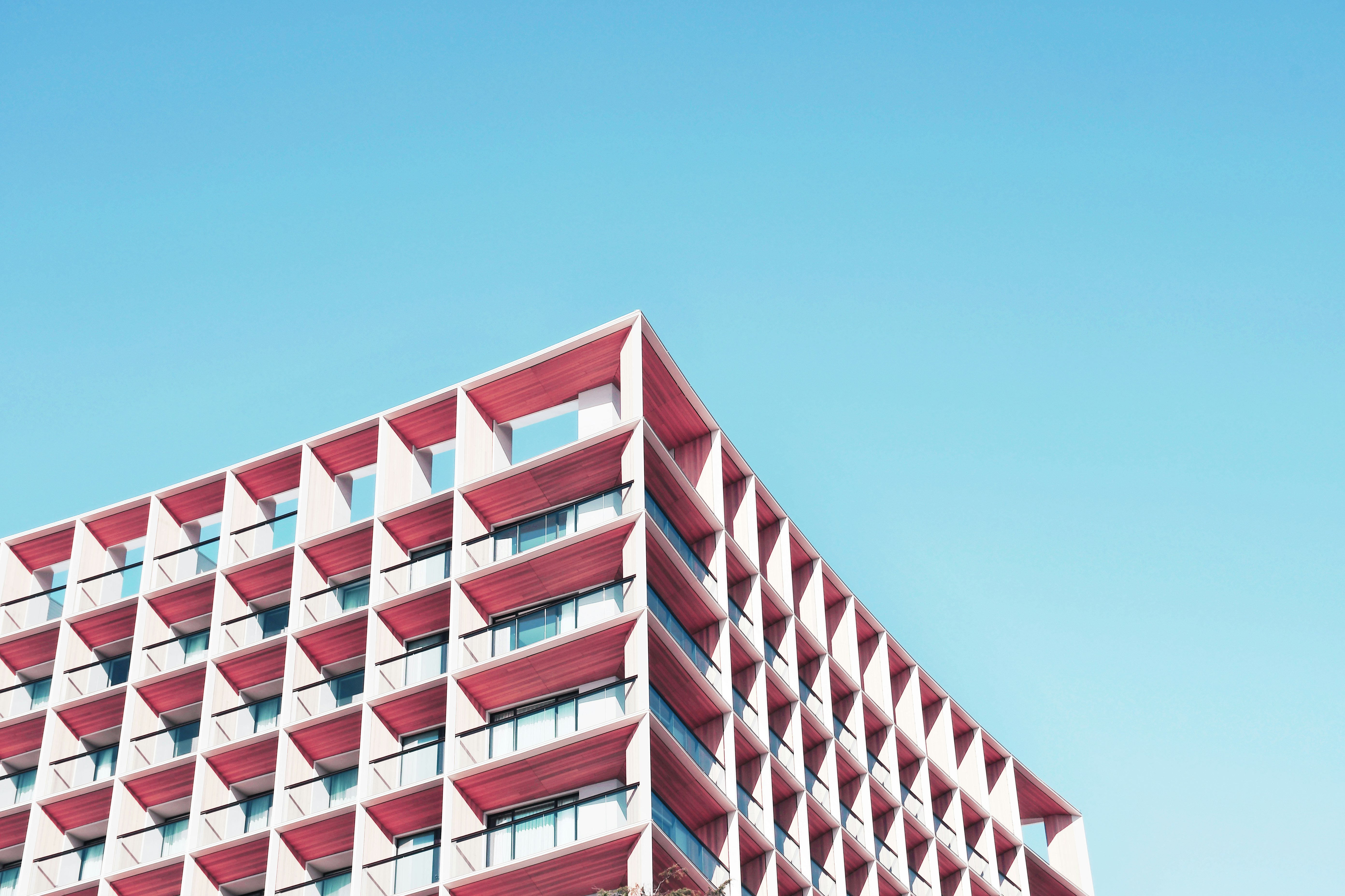 brown and white concrete building under blue sky during daytime